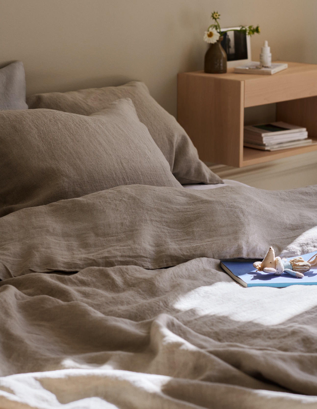 Bed made up with linen sheets