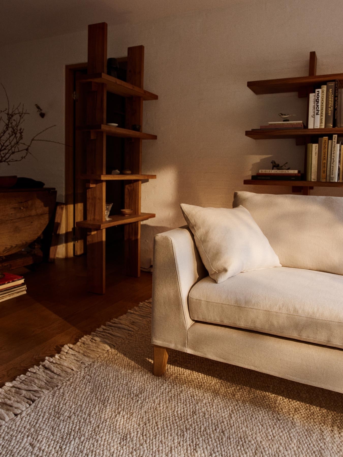 White sofa and large fluffy rug in a living room setting