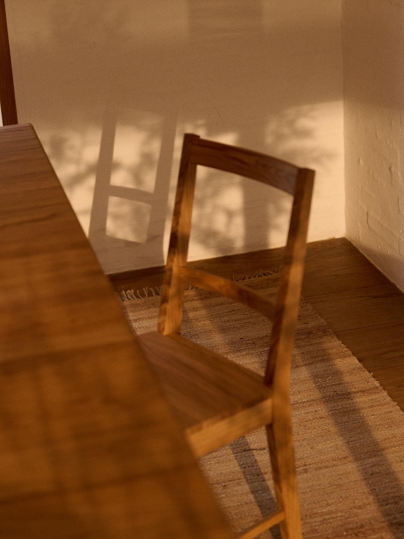 Oak dining table and chair on a hemp rug