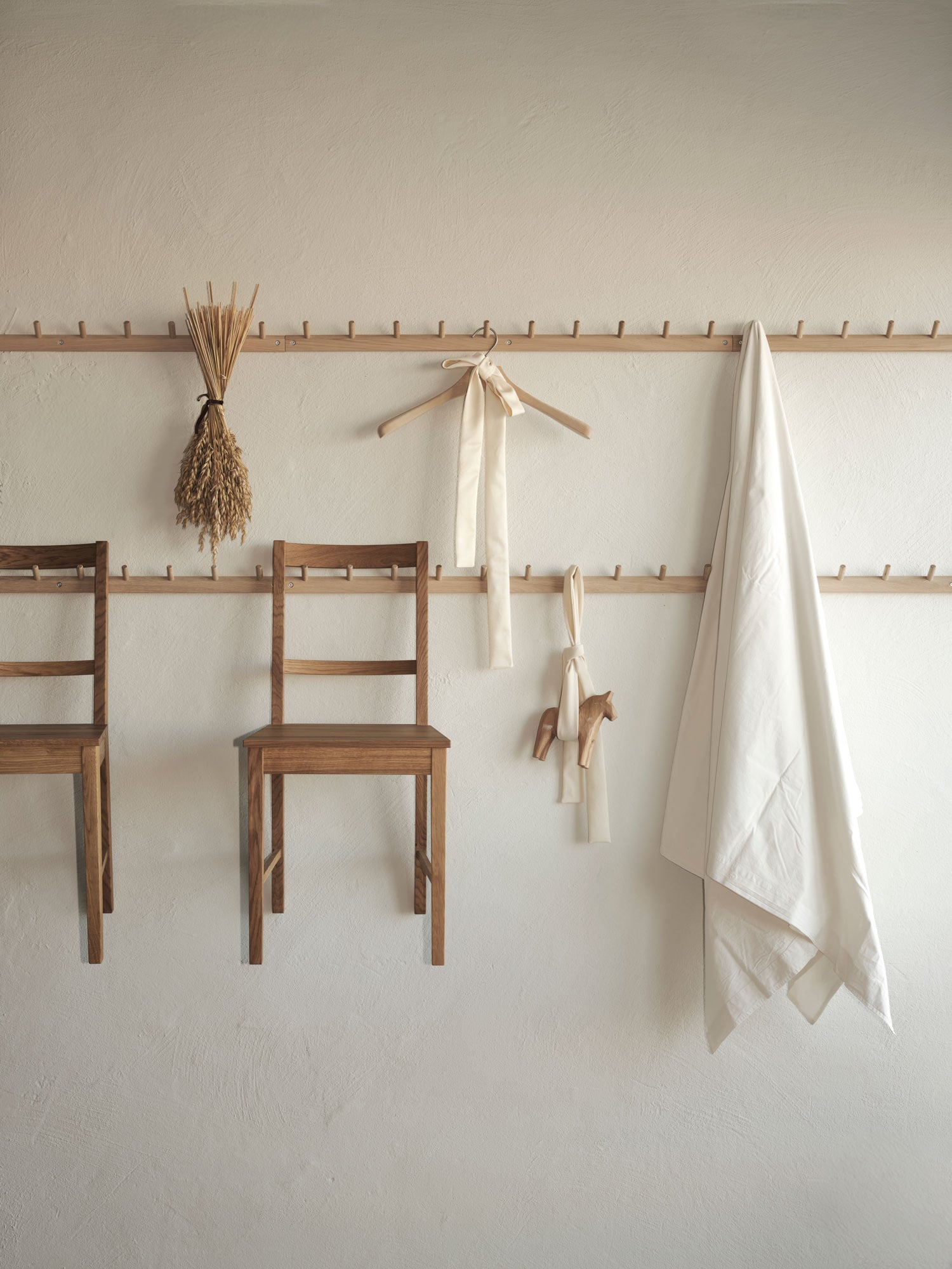 long row of hooks with hanging objects