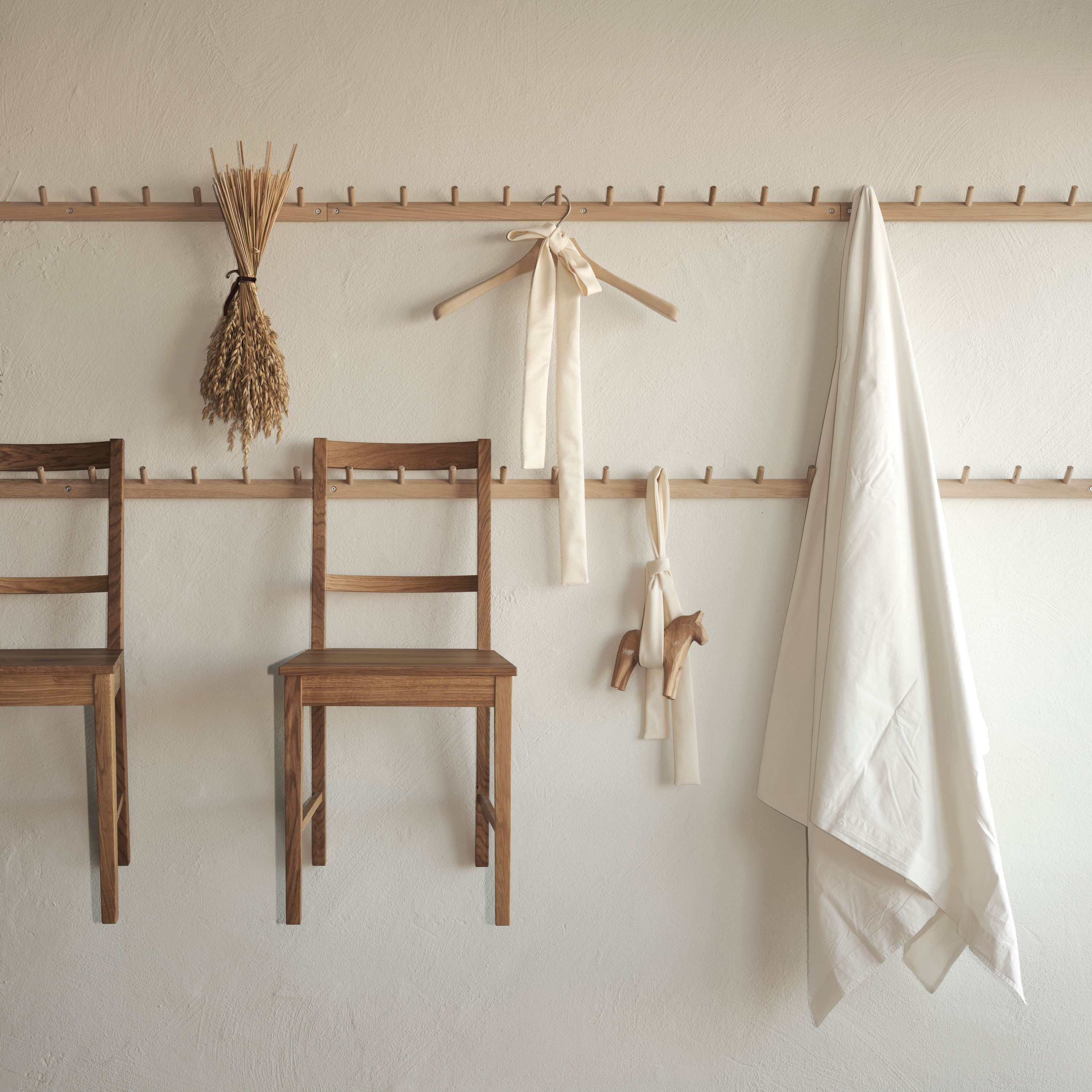 peg rails in oak with hanging objects