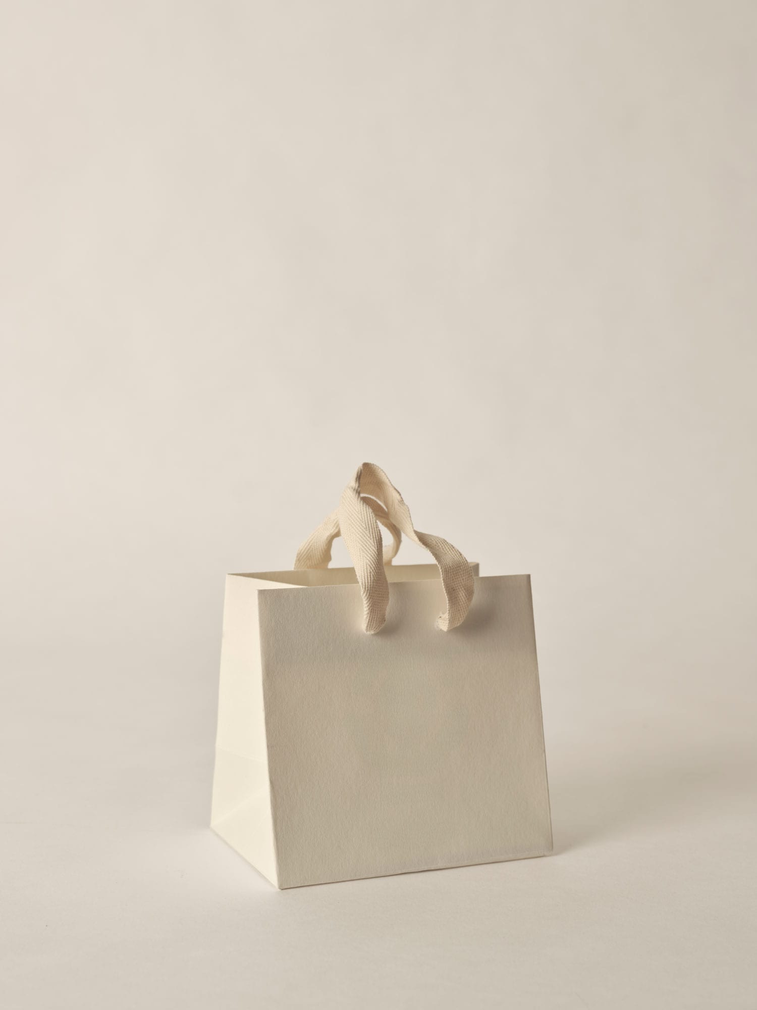 down feathers scattered on a white sheet